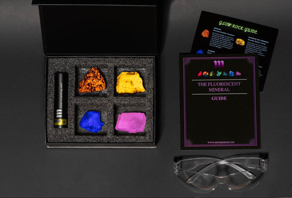 fluorescent mineral kit with fluorescent sodalite or yooperlite, wernerite, fluorite, calcite with a UV flashlight