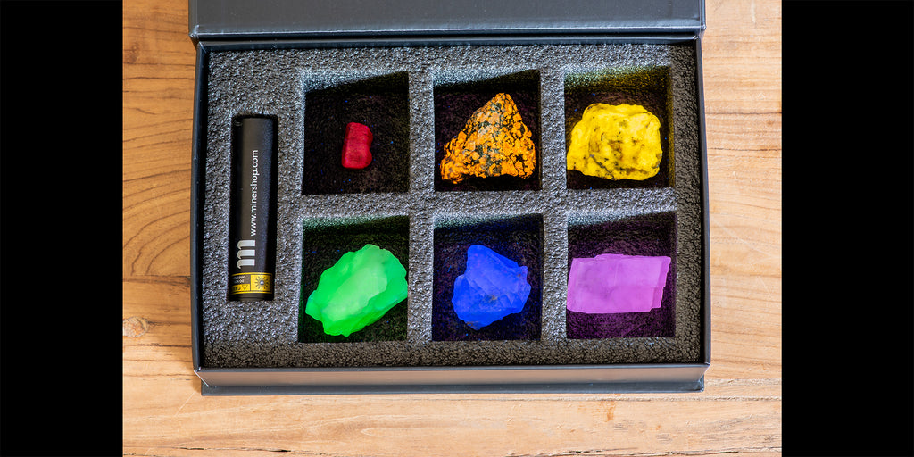 Fluorescent Mineral Collection Kit with fluorescent sodalite, ruby, green opal and pink calcite. It also comes with a UV flashlight.