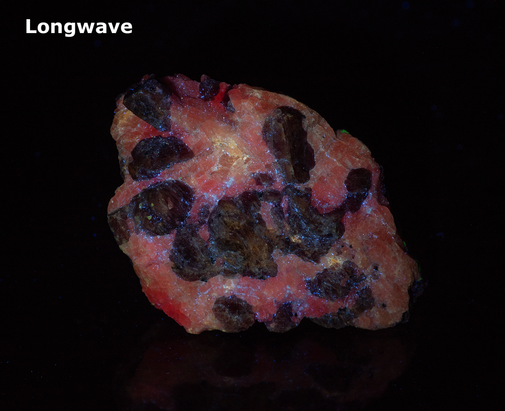 Deep Pink Rhodonite Crystals with Fluorescing Calcite from Franklin Mine