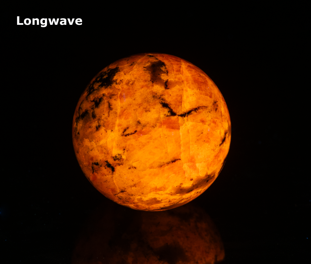 fluorescent sodalite sphere with deep tenebrescence