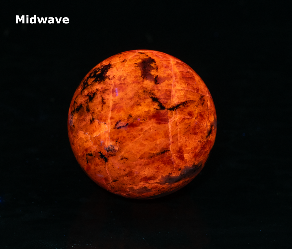 fluorescent sodalite sphere with deep tenebrescence