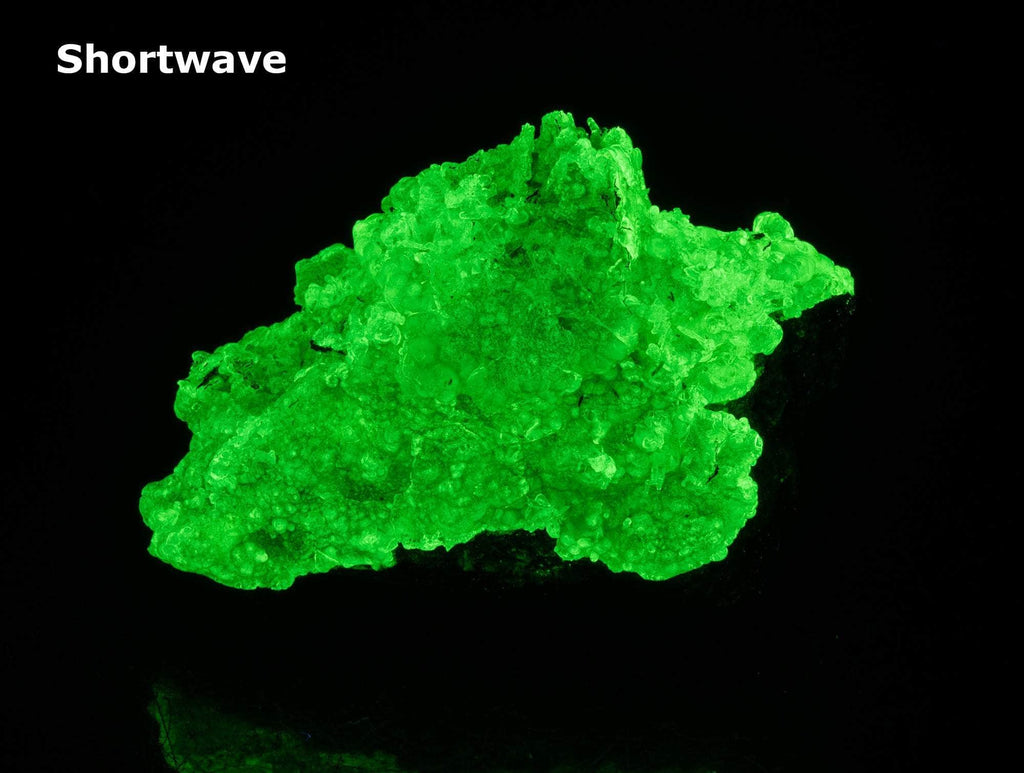 glassy bubbles of hyalite opal that are brightly fluorescent under all wavelengths