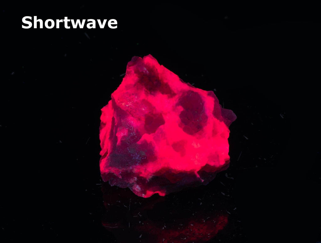 A classic piece of bright red fluorescent tugtupite 