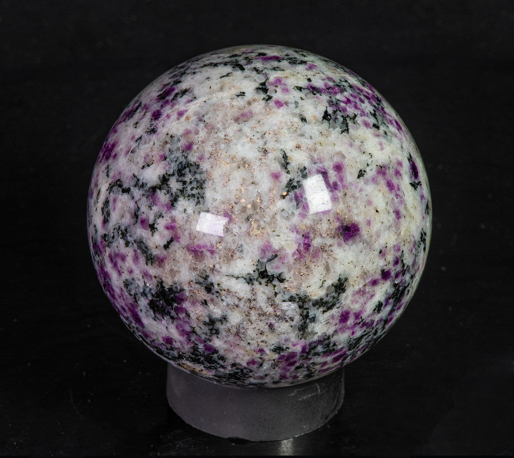 Fantasy rock sphere with sodalite, tugtupite, chkalovite, analcime from greenland. Tenebrescent.