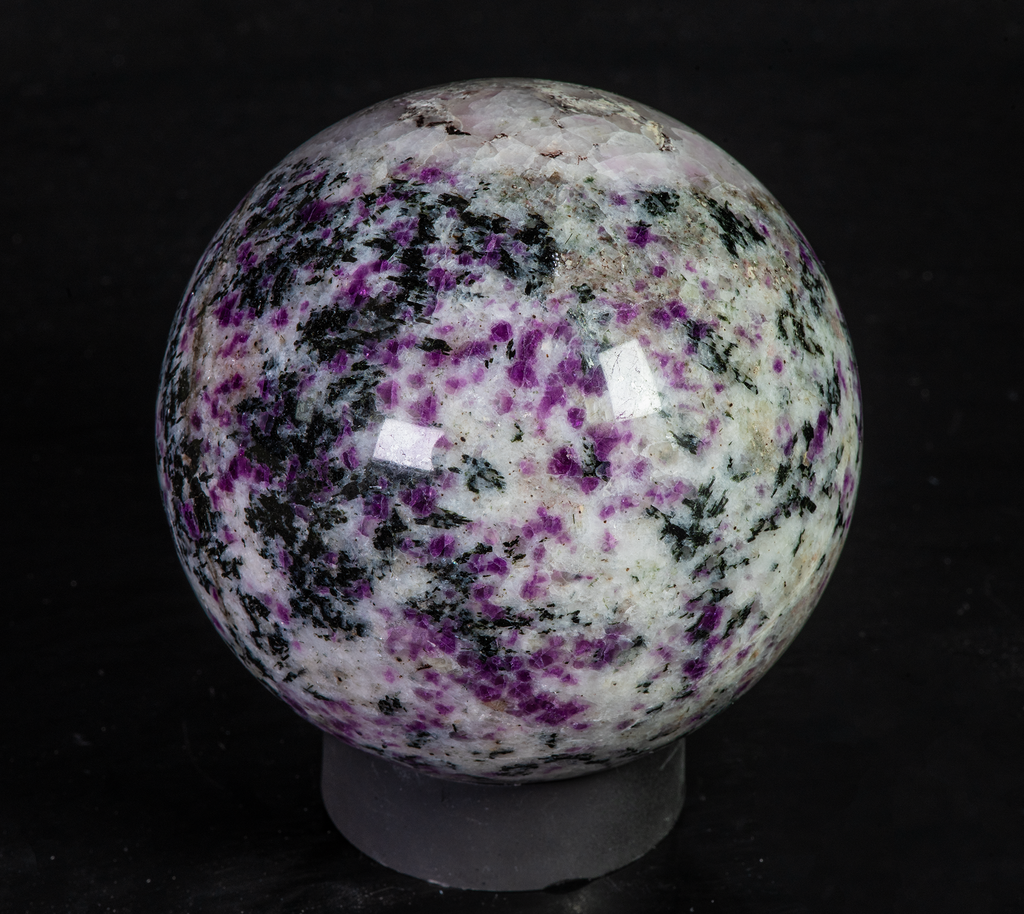 Fantasy rock sphere with sodalite, tugtupite, chkalovite, analcime from greenland. Tenebrescent.