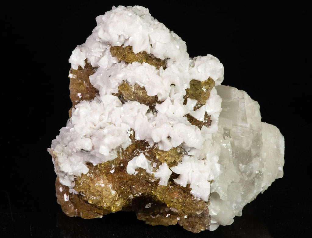  calcite in two different habits along with cubic honey brown fluorite crystals. 