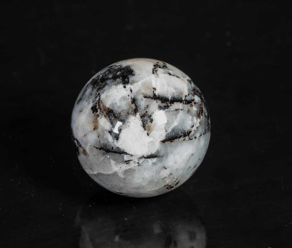 tugtupite and silver polylithionite sphere from Greenland