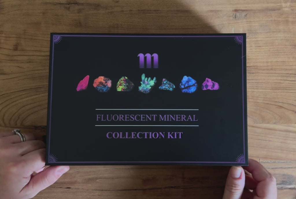 fluorescent rock collection kit containing fluorescent sodalite, ruby, wernerite, opal and a UV flashlight